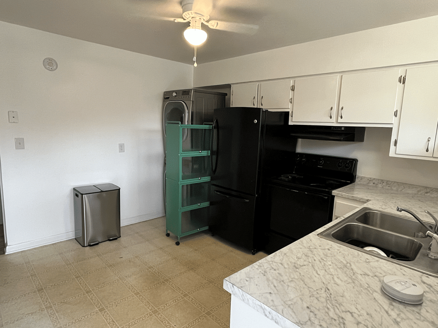 Kitchen operation across from breakfast pantry.  Outfitted with cooktop and oven, full refrigerator, and a full washer and dryer. 