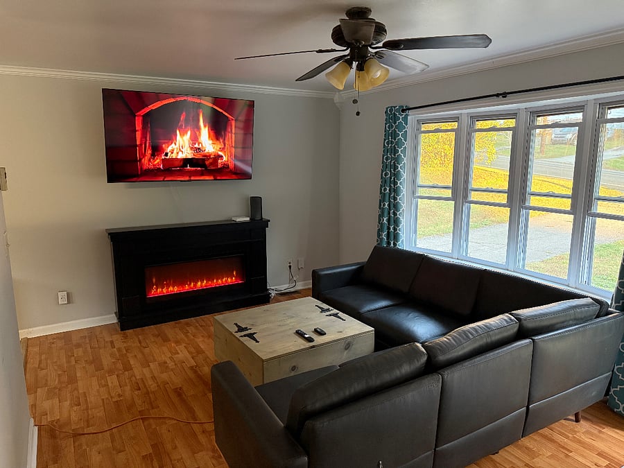 New leather couch, 65 new Smart TV, remote control electric fireplace