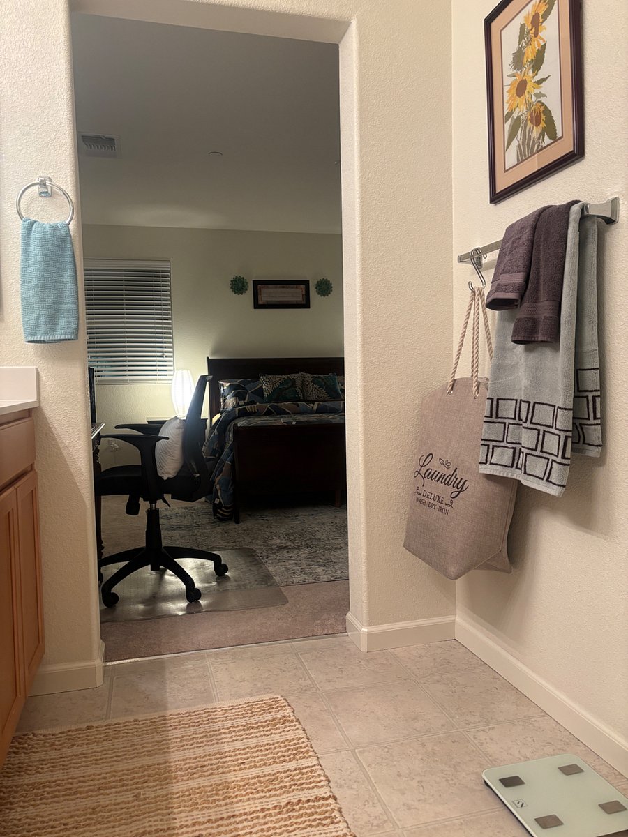 View from the separate tub/shower, toilet, and walk-in closet areas