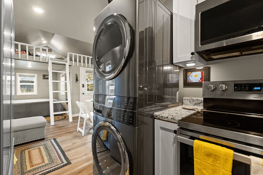 Brand new Electrolux laundry tower and brand new range with air fryer feature and microwave overhead