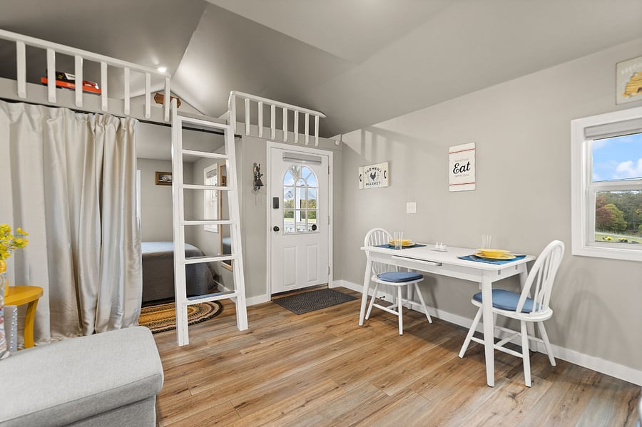 Your cozy bedroom has a noise-reducing privacy curtain and the table reduces to a table for two to give more room.