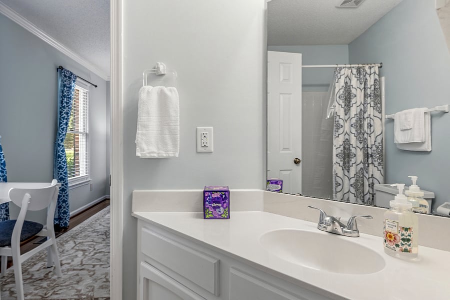Main Floor Suite Private Bathroom. Lockable access to front entry hall.