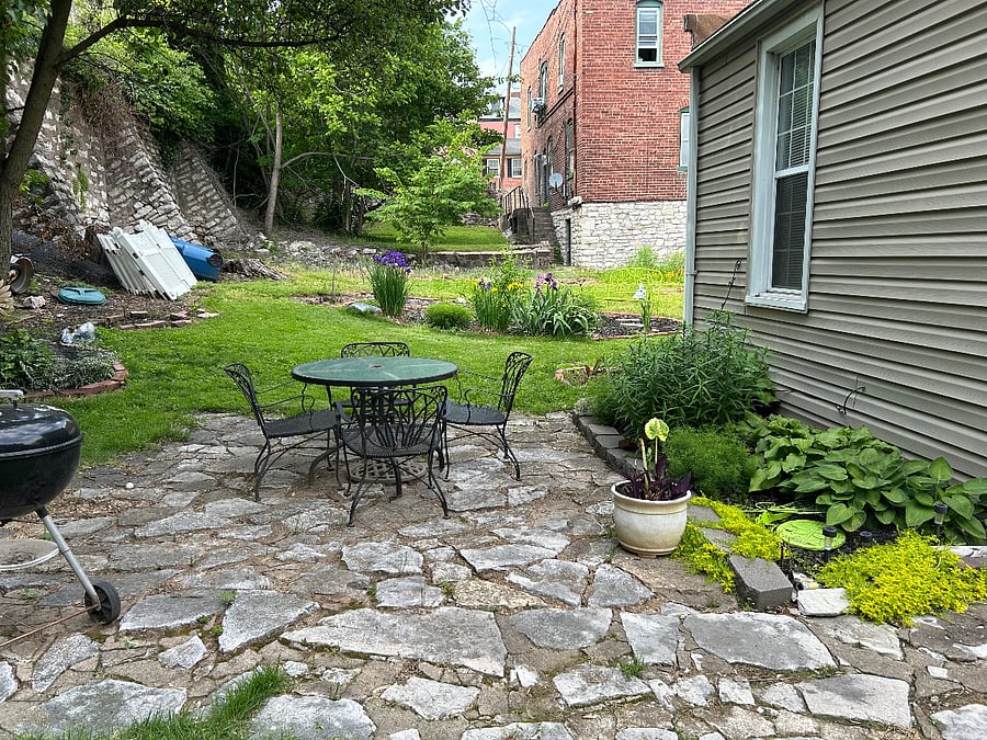 Back yard patio. Also adjoining lot is a work in progressit belongs to house property also!!