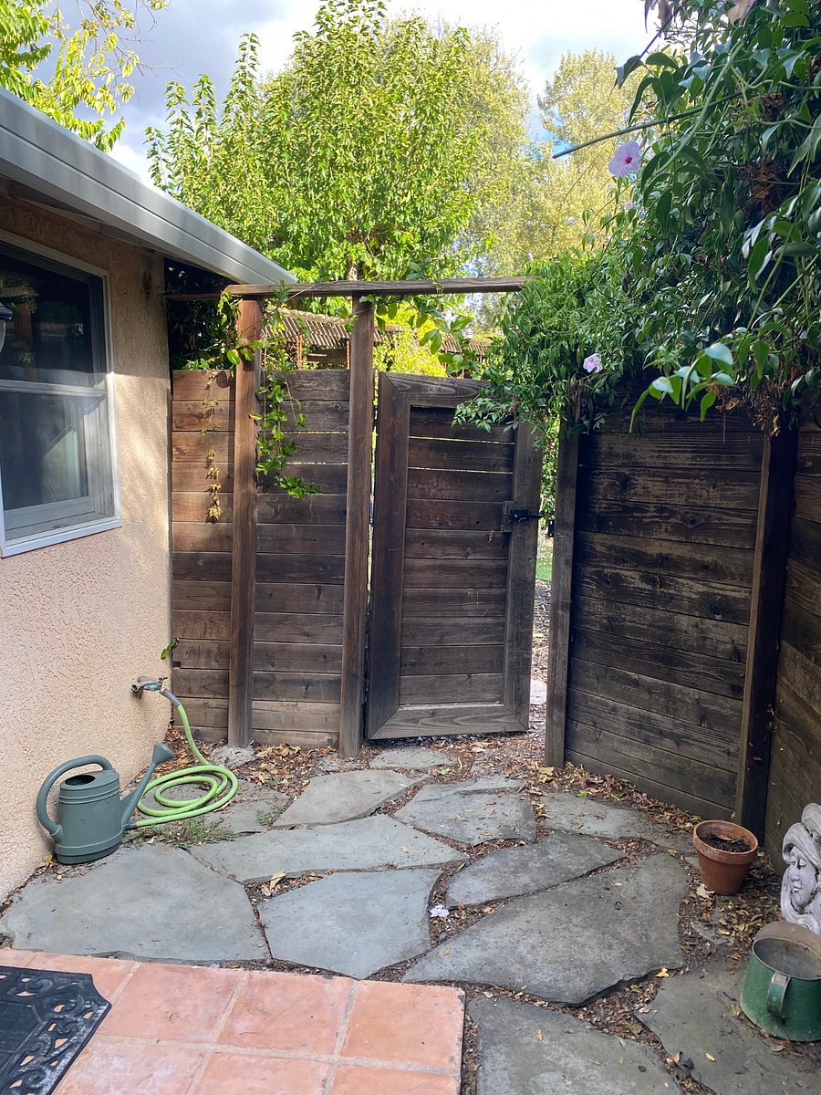 Your patio gate that exits to Landlord's pool & backyard