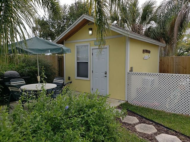 Exterior of cottage with private patio & table