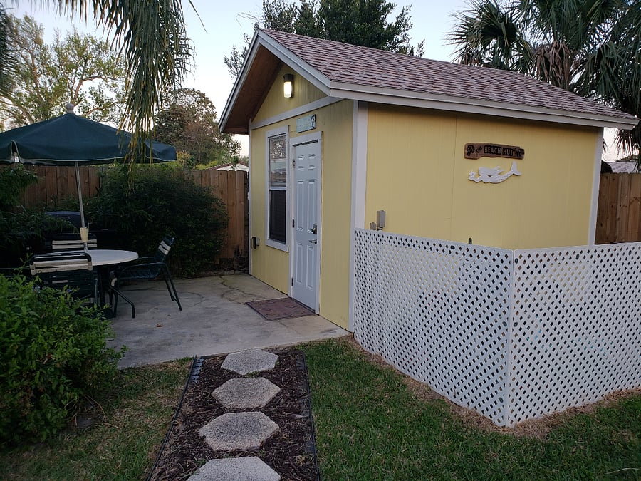 Exterior of cottage with private patio & table