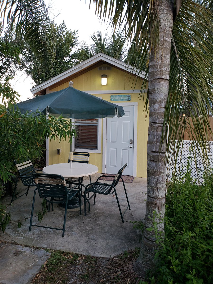 Exterior of cottage with private patio & table
