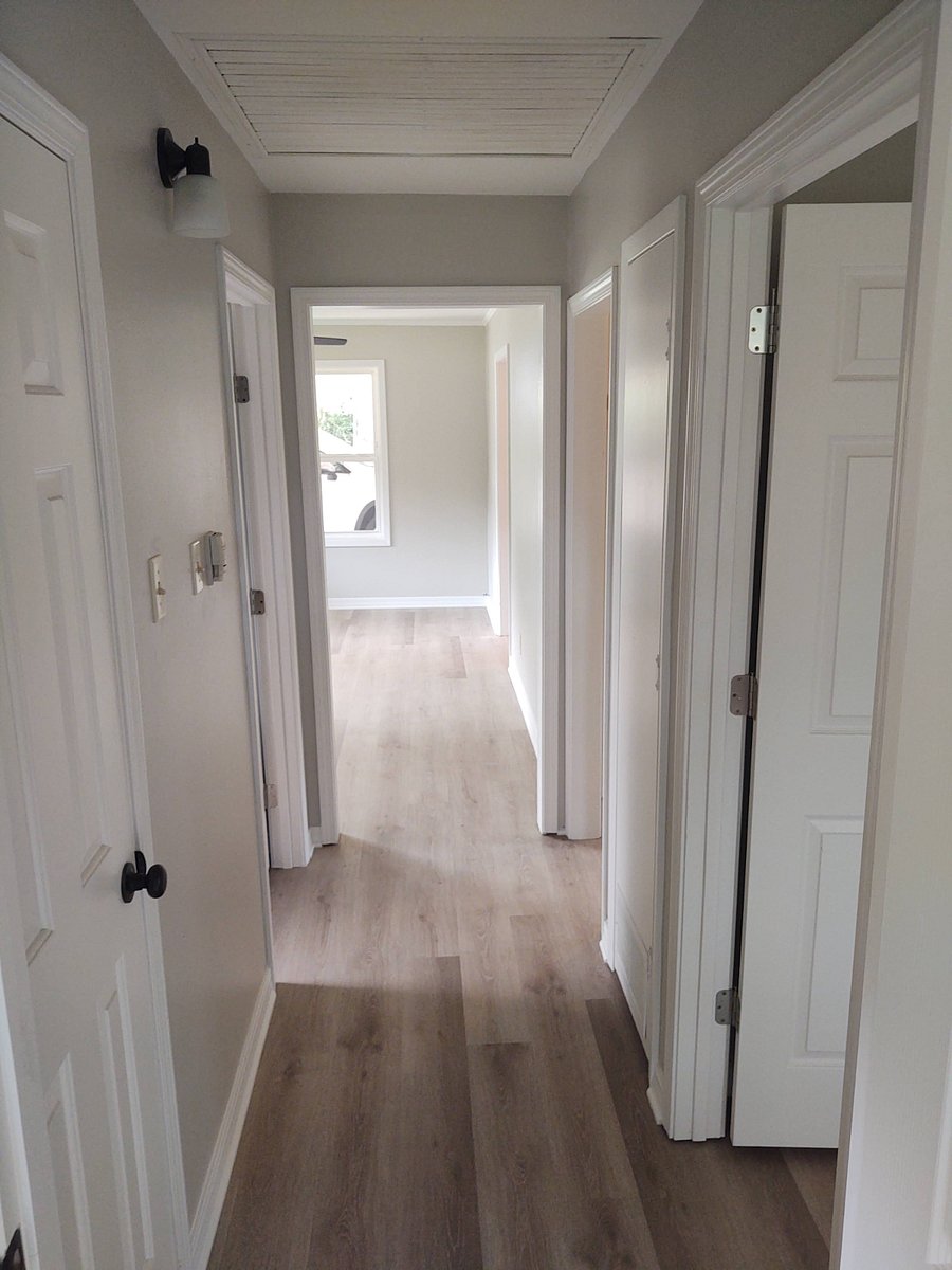 Hallway to both bedrooms & bath