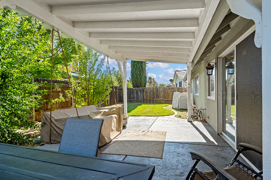 SHARED backyard area. With swinging daybed/bench, and outdoor table/chairs. Solo Stove available for use. 