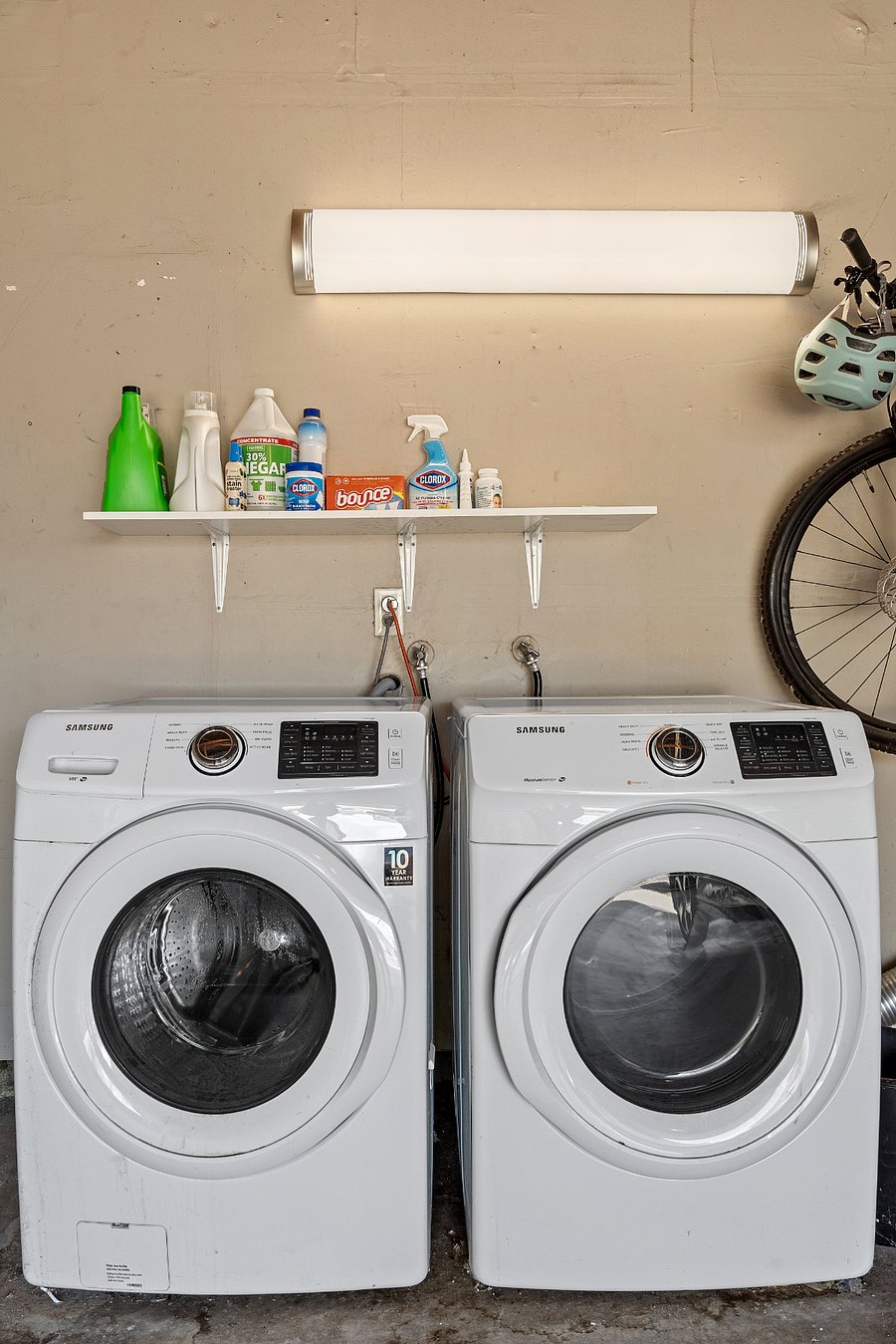 SHARED main laundry area in garage. Designated parking spot (plus additional driveway and street parking). Bike and paddle board available for use. 