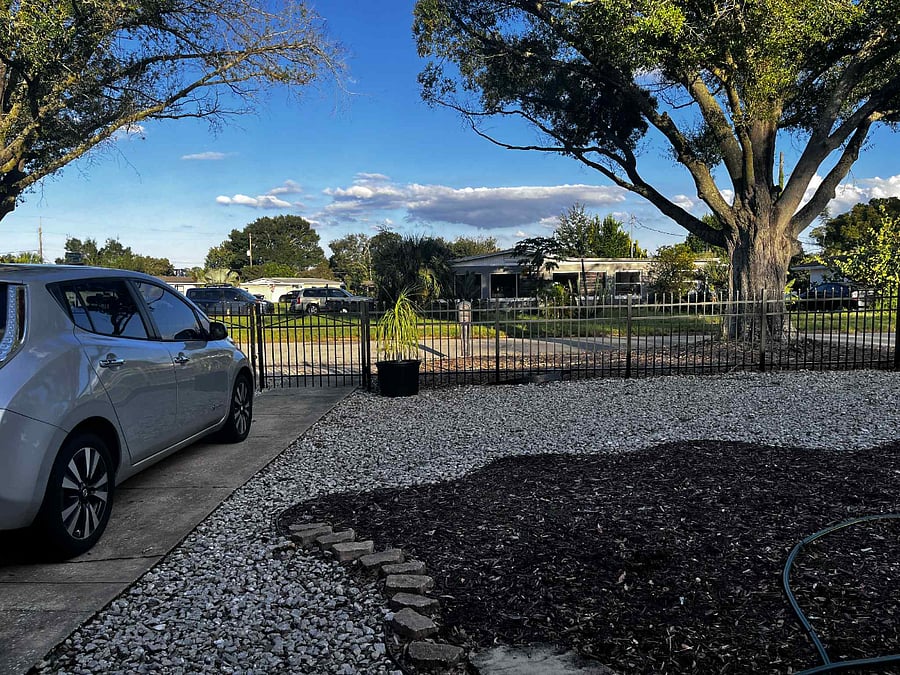 Large front yard with parking space within the gated permise in a safe, quiet, and clean neighborhood