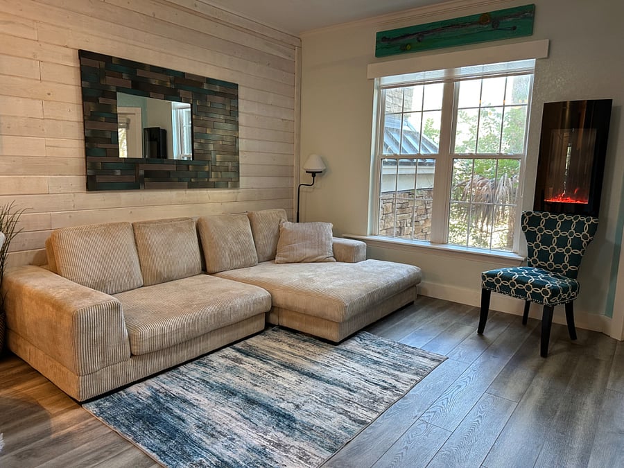 Super comfortable couch. Wall mounted faux fireplace with multiple fire colors and can put out real heat if desired.