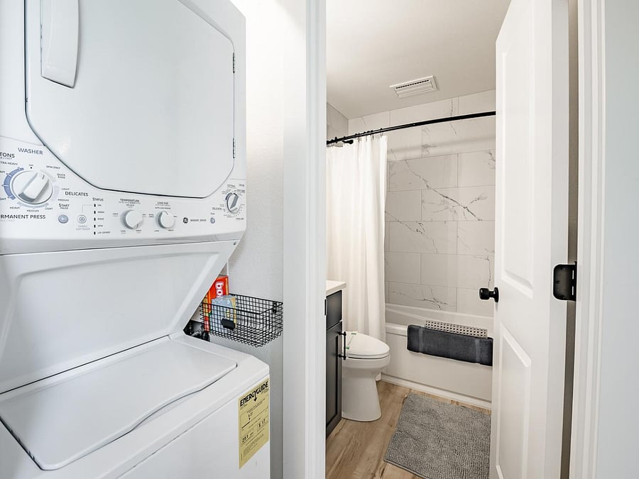 Compact laundry area with convenient stacked washer and dryer