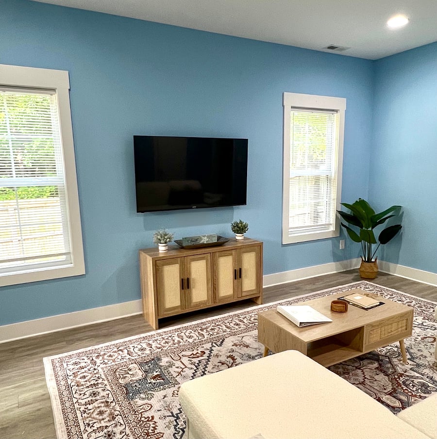 Living Room with Smart TV/streaming services
games and DVDs in cabinet