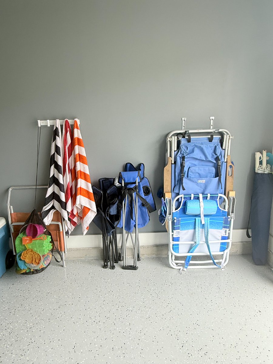 Well stocked with beach chairs, canopy, toys and towels
