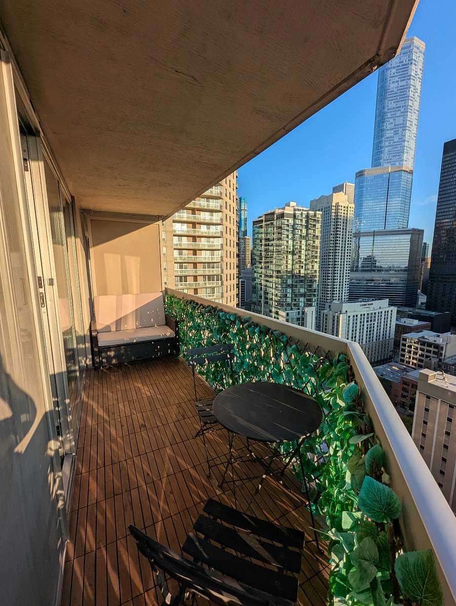 Balcony with couch and bistro table