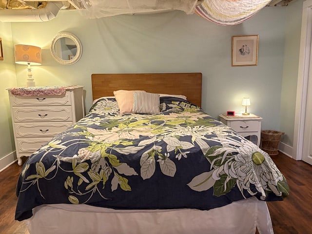 Plush queen bed with designer bedding