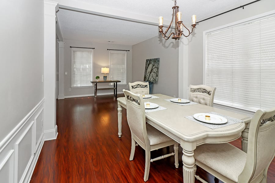 Gather in this cozy dining area, with warm wood floors and a welcoming vibe thats perfect for shared meals and good conversation.