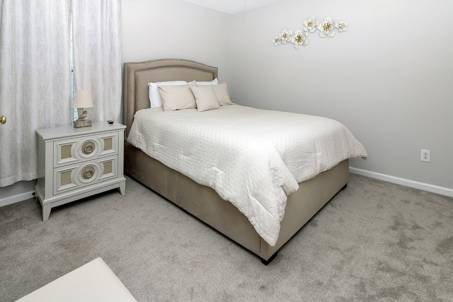 Youll love this cozy bedroomfeaturing a comfy queen bed with soft, inviting linens that make it easy to relax and feel right at home.