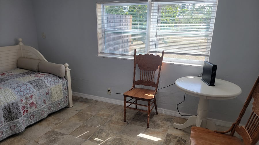 Small table and chairs in 3rd bedroom with trundle bed. 