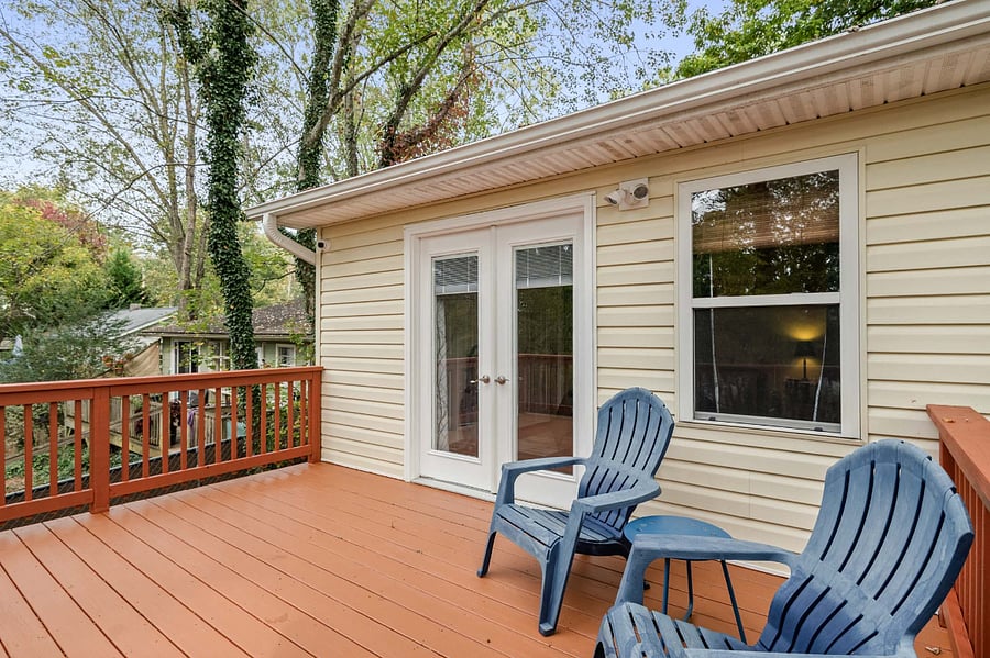 Back deck located off primary suite. Property offers a fully fenced in yard.