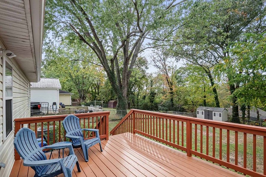 Back deck located off primary suite. Property offers a fully fenced in yard.