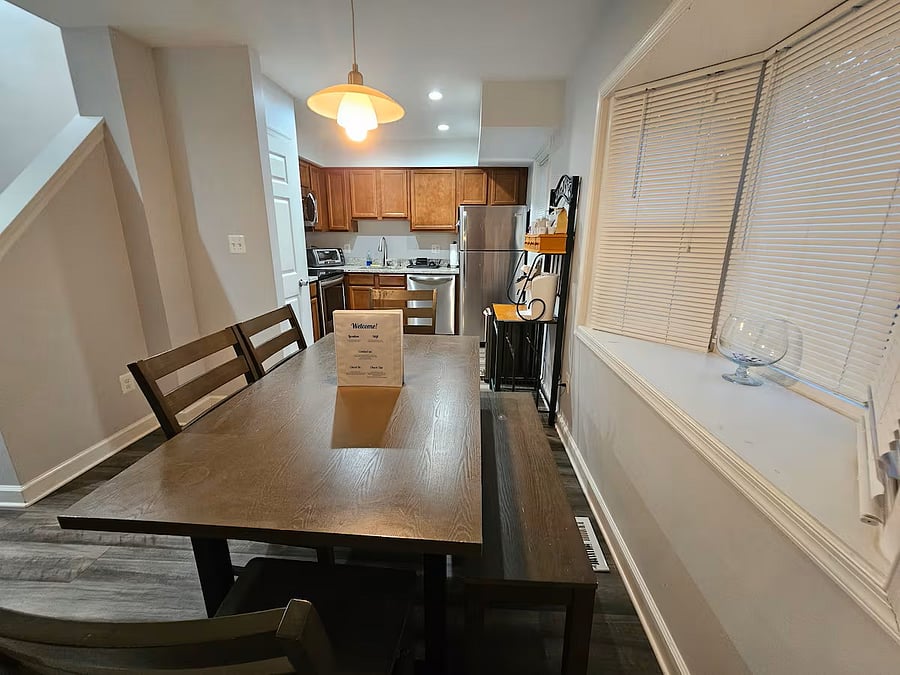 View of dining room table and kitchen