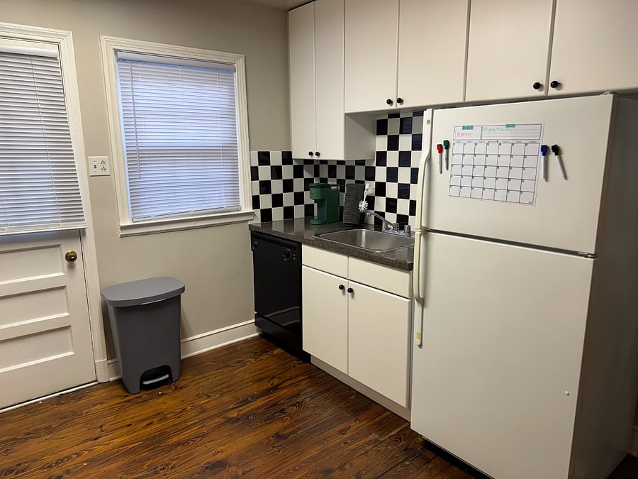 Kitchen features full-sized fridge with freezer and ice-maker, dishwasher, oven, range microwave, and complimentary Keurig.
The kitchen is fully stocked with pots and pans, baking sheets, mixing bowls, and a strainer.