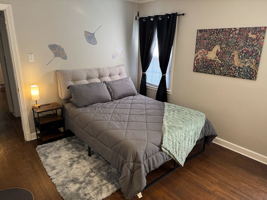 Bedroom features bamboo memory foam Queen bed and ample outlets beside the bed for all your devices. The windows are dressed with black-out curtains