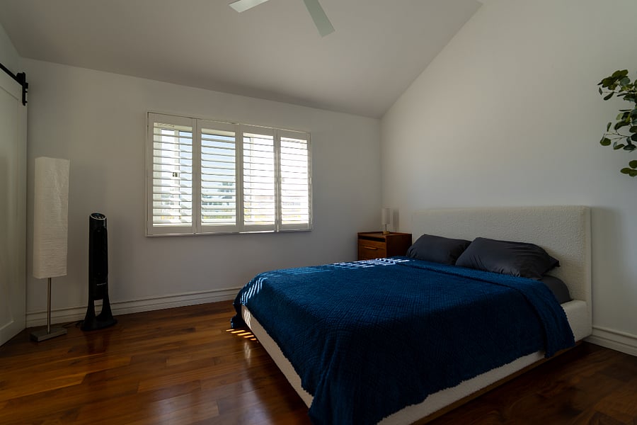 Guest bedroom.  Access the bathroom through the barn doors on the left