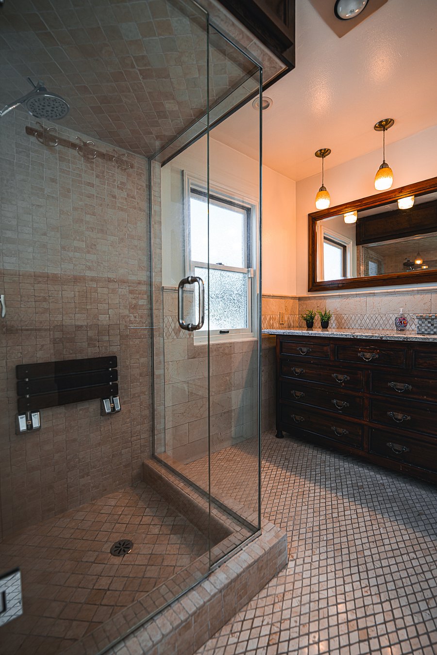 Primary suite bathroom.  The shower has a sauna setting, as well 
