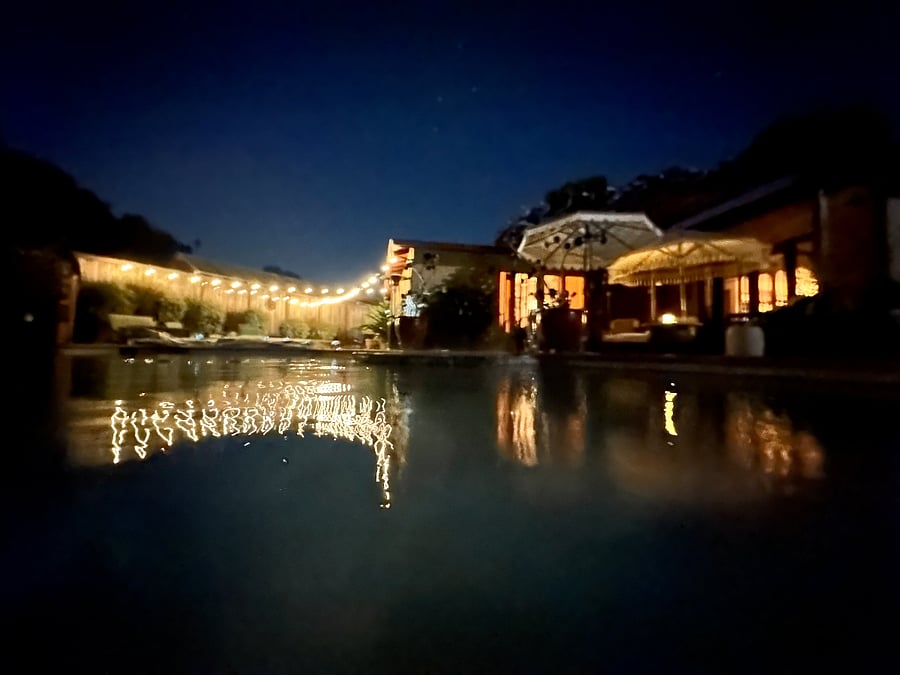 Pool and hot tub at night