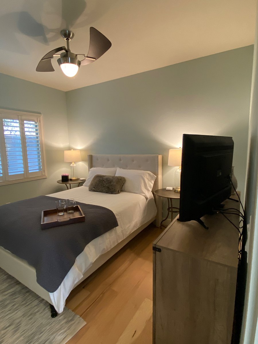 Queen size bed with luxurious linens, large closet, TV and six drawer dresser 