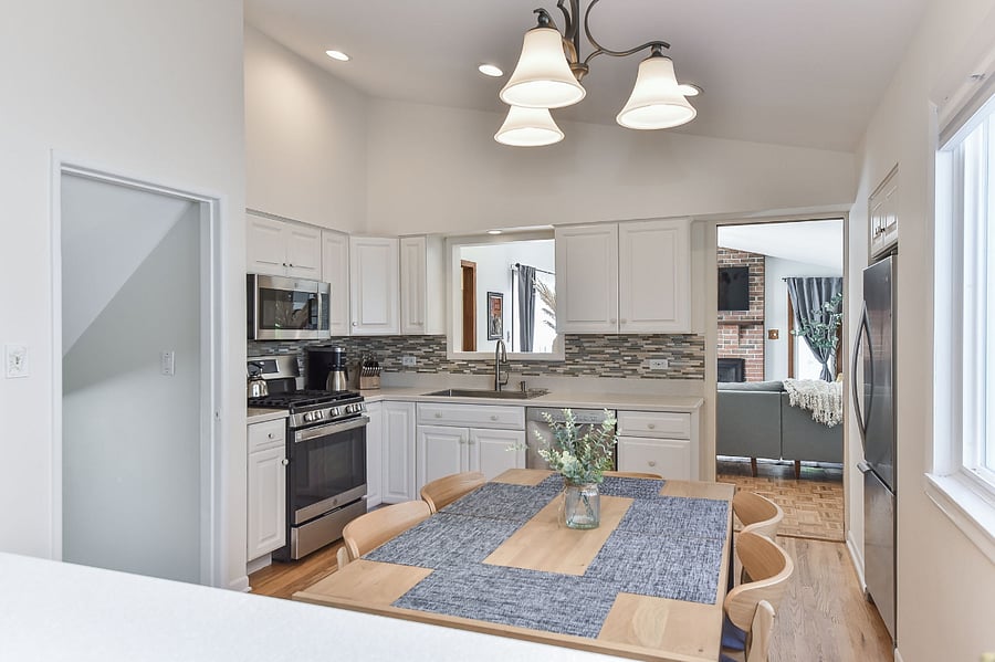 Bright kitchen, featuring stainless steel appliances.  