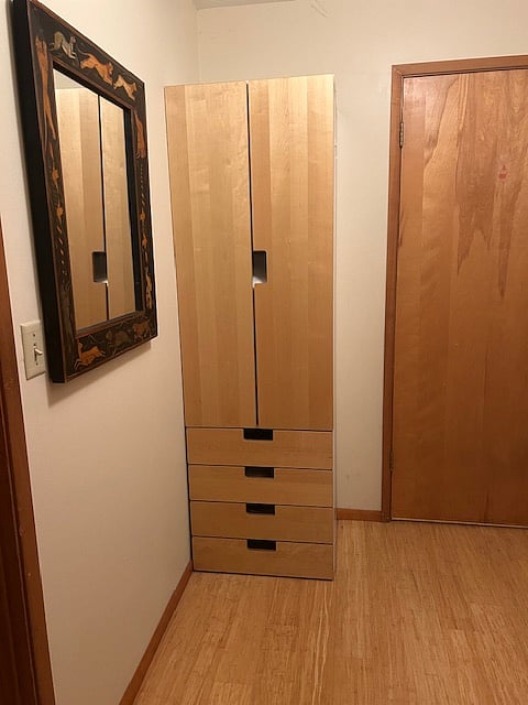 Additional closet with drawers.