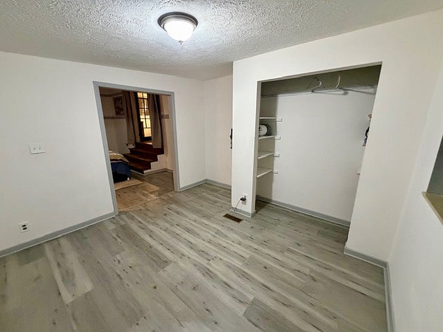 Extra room off of the downstairs bedroom with a closet and dresser
