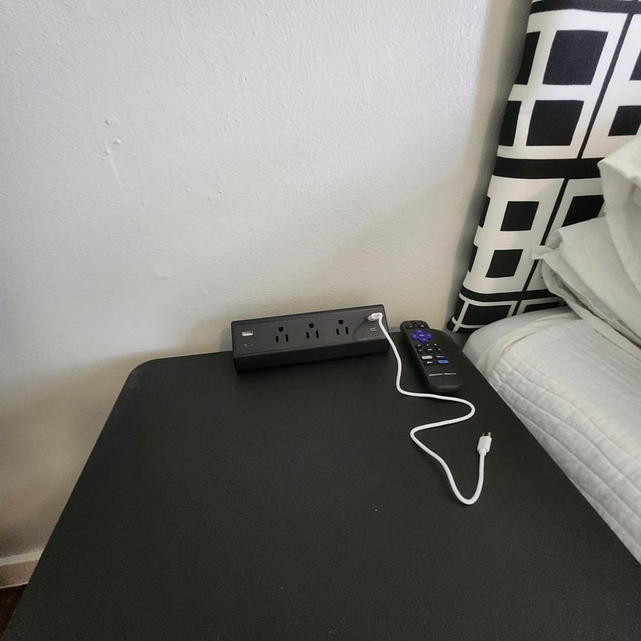 Each bedroom has side table with power station.