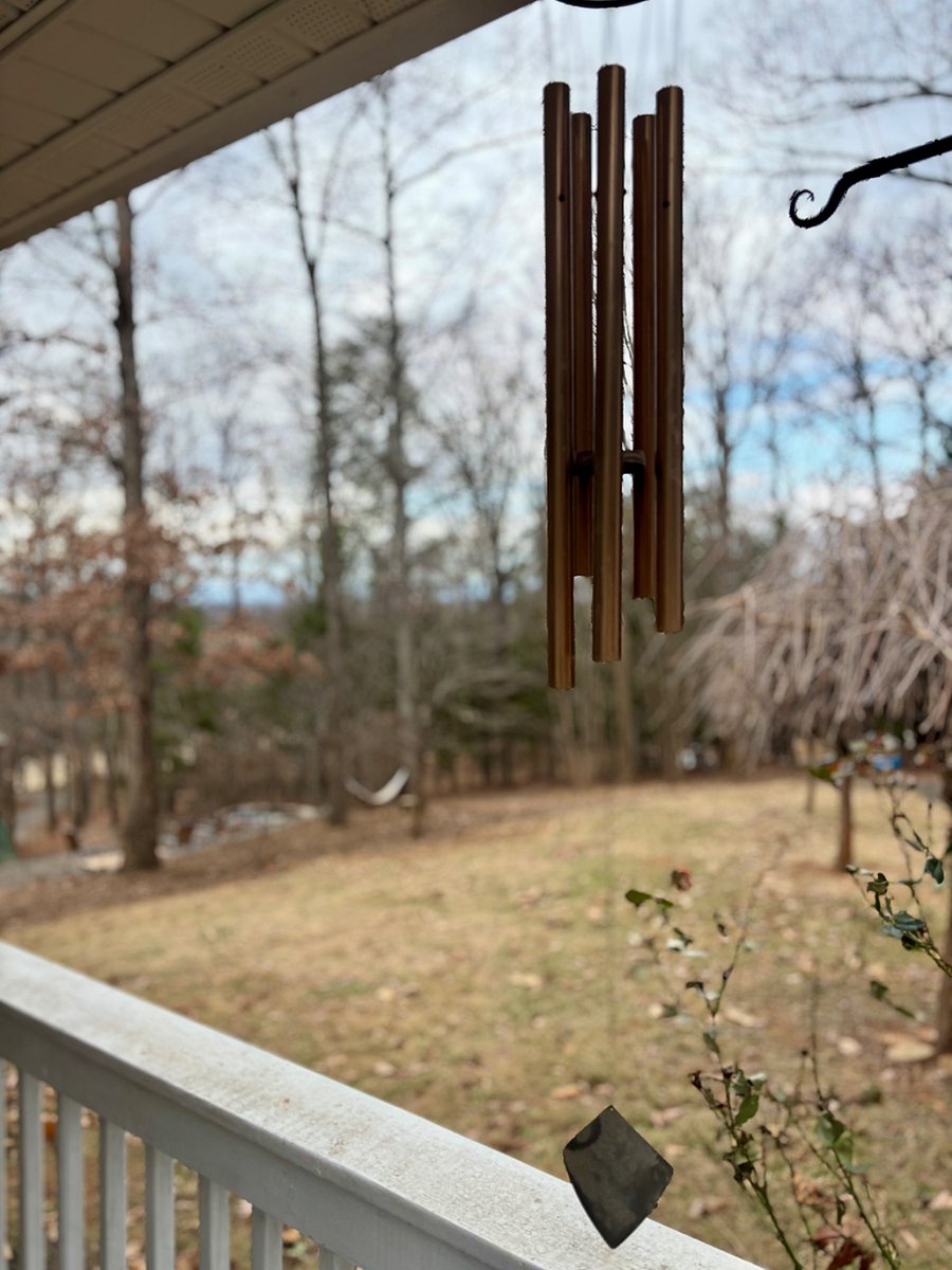 Porch with seating area overlooks the yard. Access from living room or front porch.