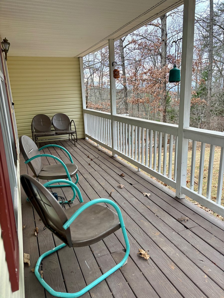 Porch with seating area overlooks the yard. Access from living room or front porch.