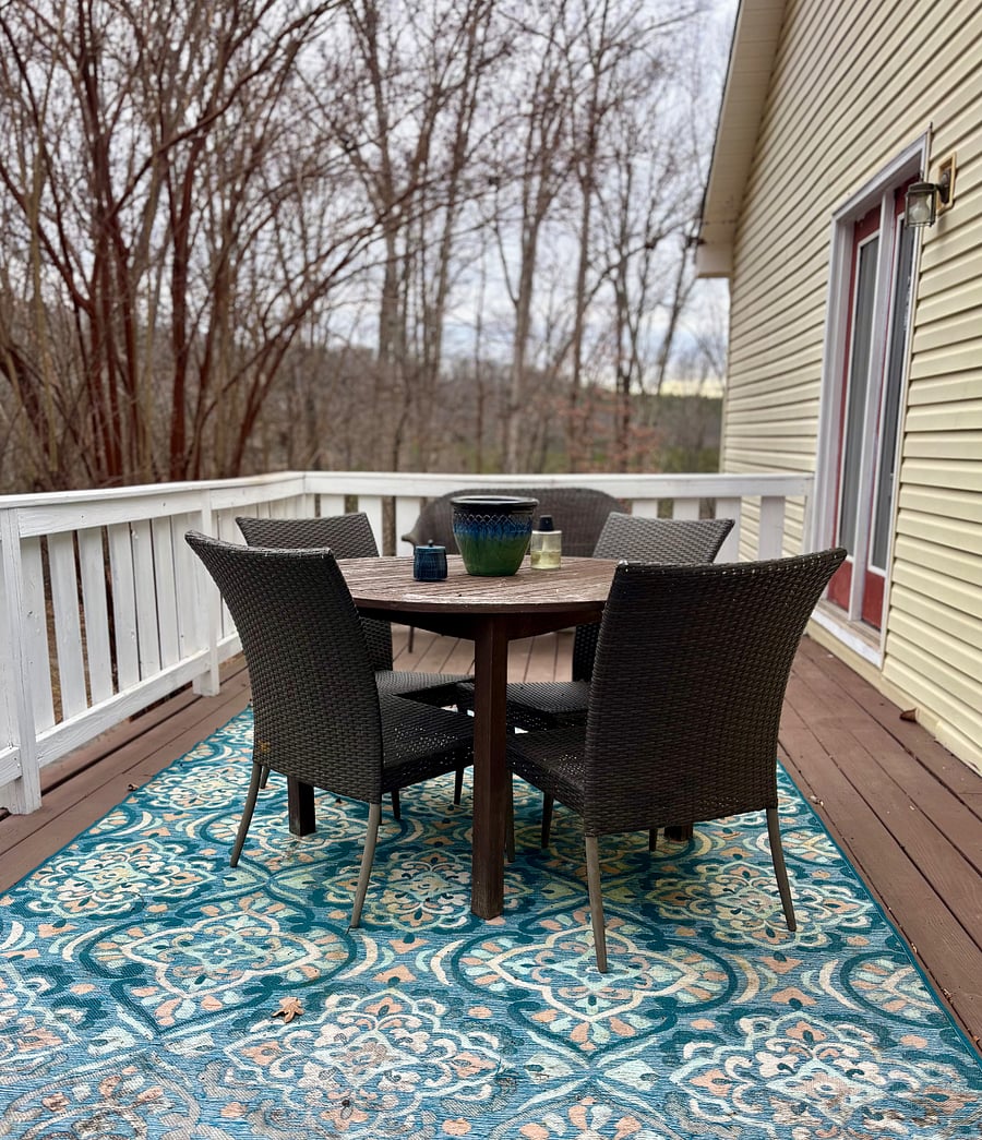 Deck with outdoor dining for 4 and lounge seating. Interior access from dining room or master bedroom. 