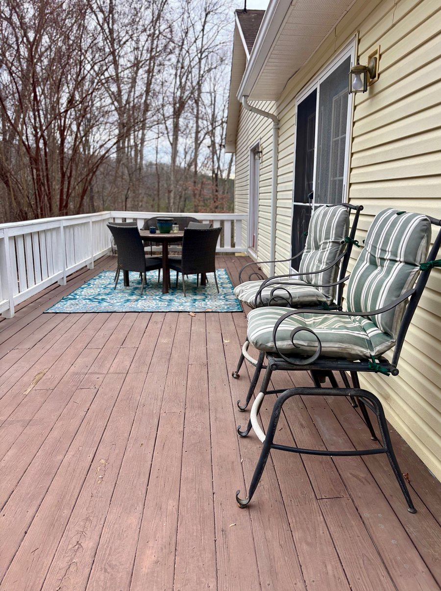 Deck with outdoor dining for 4 and lounge seating. Interior access from dining room or master bedroom. 