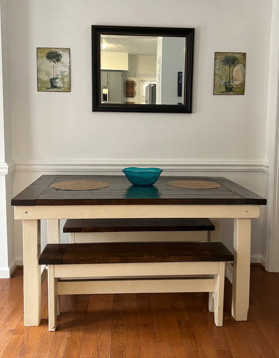 Dining room with farm house table and counter barstools. French doors lead to deck with outdoor dining and lounge seating. Interior door to the right opens to large walk-in pantry,