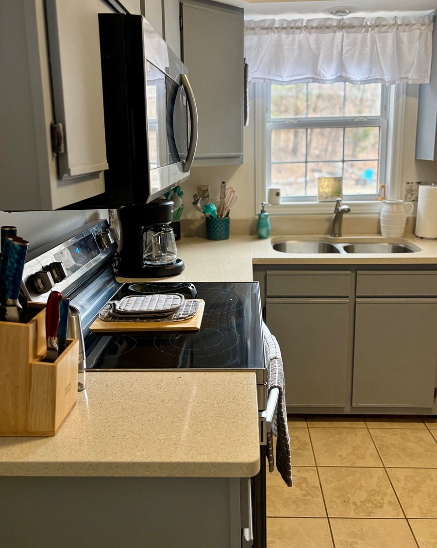 Fully stocked kitchen with Mircrowave, Dishwasher, Oven/Stove, Mr Coffee, Kuerig, Toaster, Blender, Counter Mixer, Ninja Pressure Cooker/Air Fryer/Dehydrator, Crock Pott, Dishes, Cups, Wine glasses, Coffee Cups, Utensils, Silverware, Pots/Pans, etc.