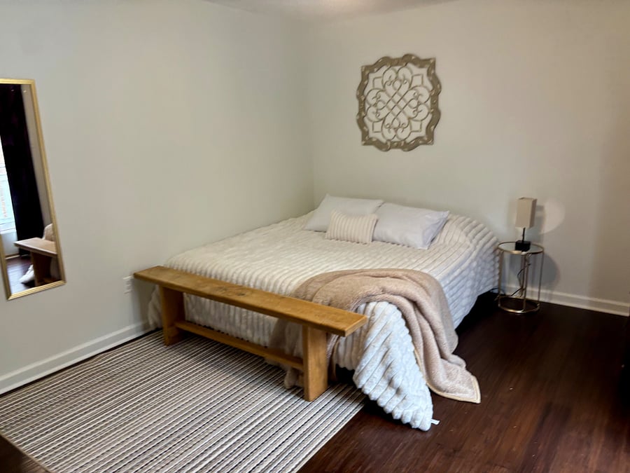 BR 1 - Master with King bed, walk-in closet, and private full bath. French doors lead to deck with outdoor dining and lounge seating.