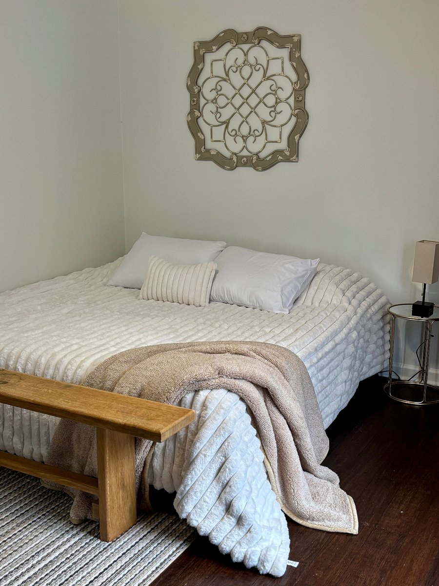 BR 1 - Master with King bed, walk-in closet, and private full bath. French doors lead to deck with outdoor dining and lounge seating.