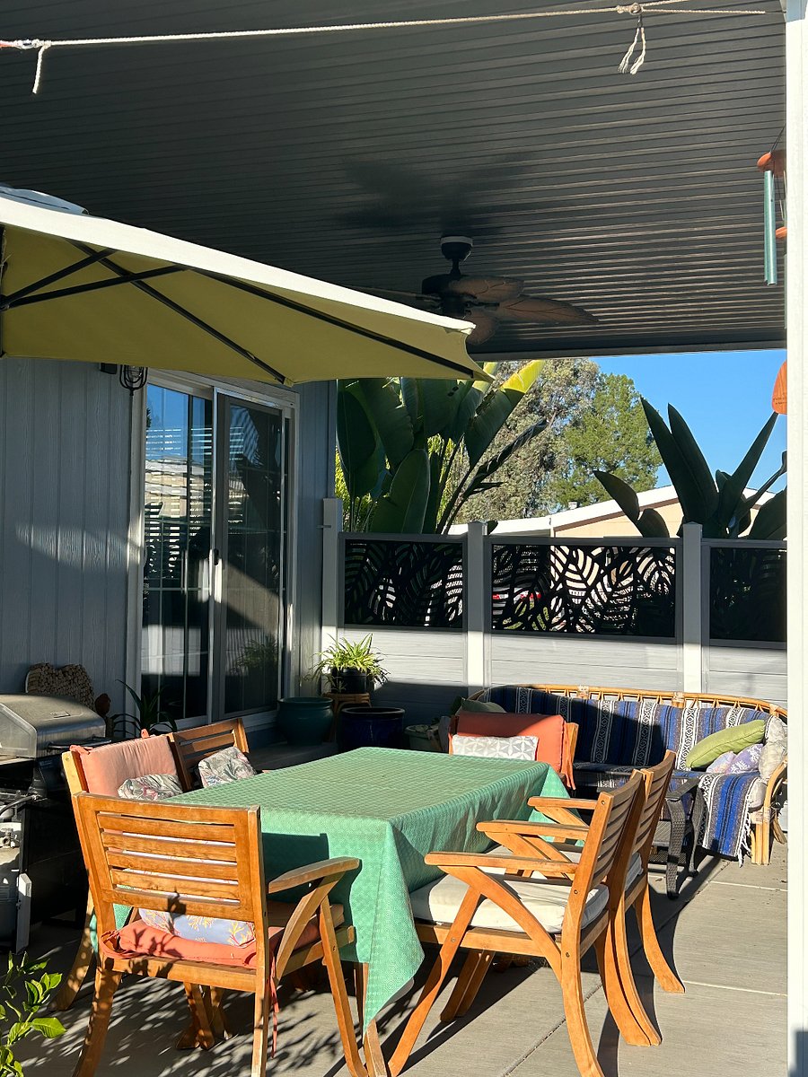 Side yard next to kitchen with grill. Great for dining al fresco.