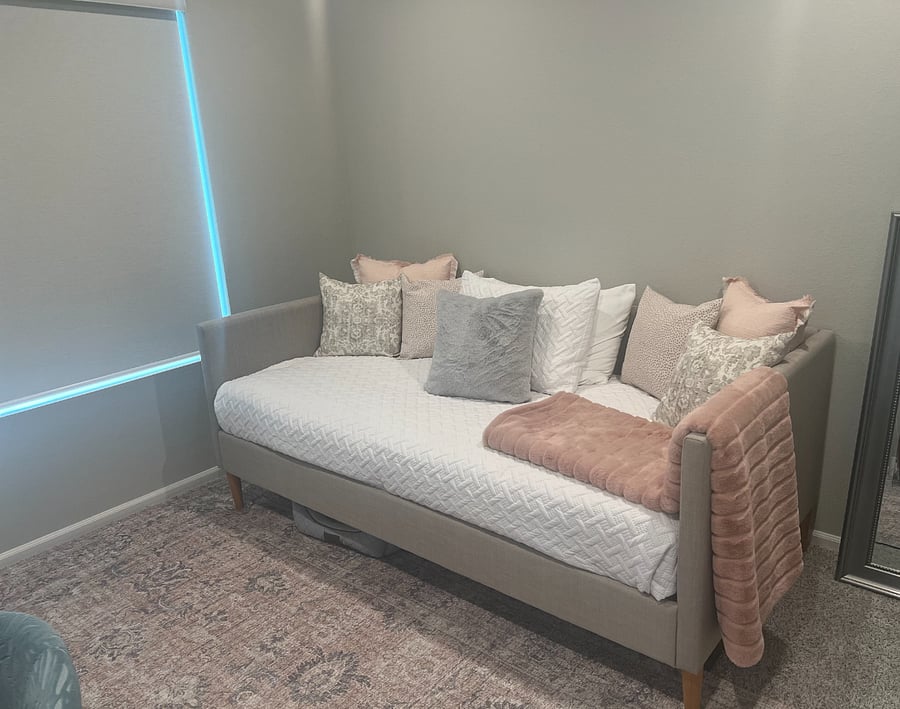 Office with desk, chair, bookcase, and daybed