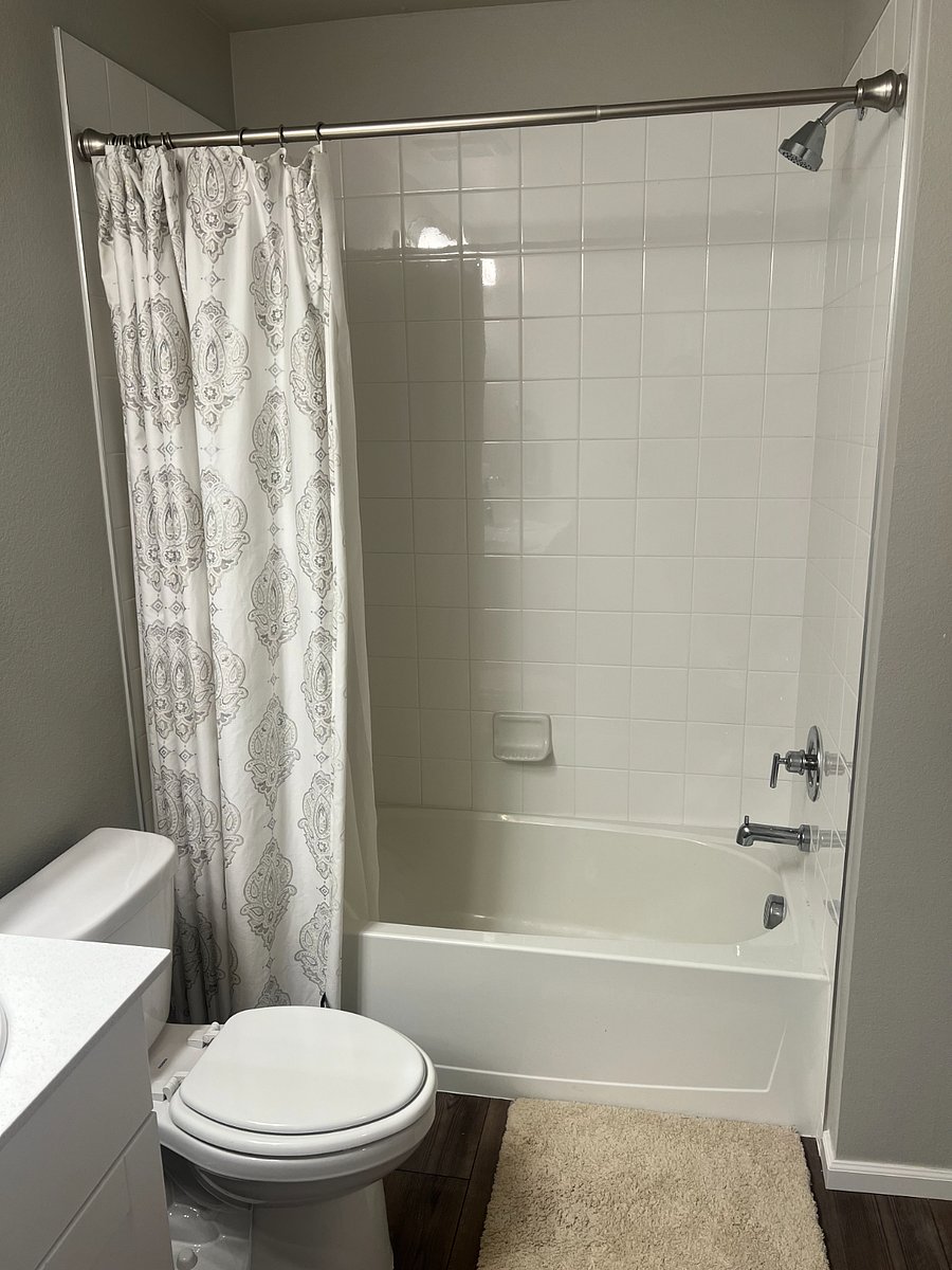 Guest bath with dual sinks, shower over tub