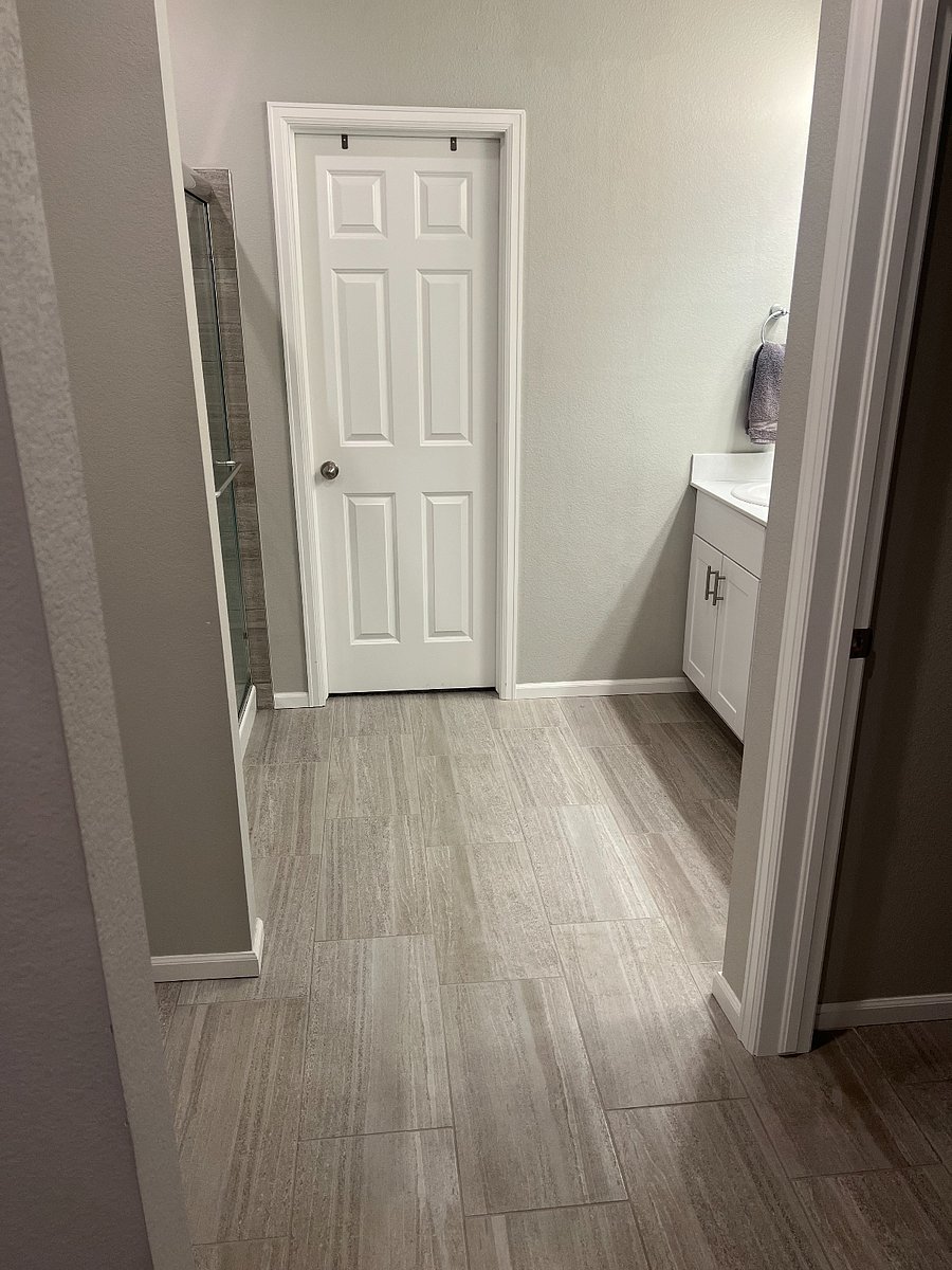 Primary bath hall from bedroom (toilet room to the right and large closet to the left)
