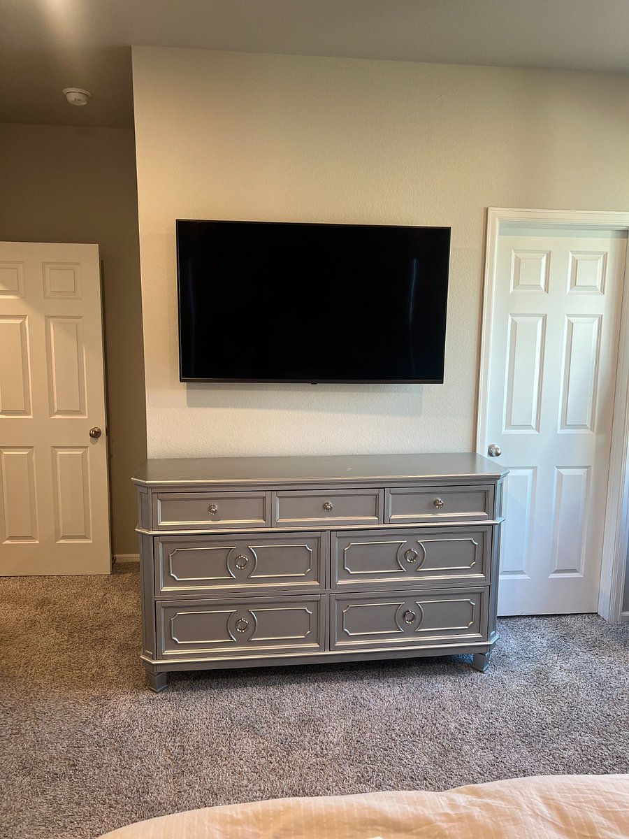 Primary bedroom dresser and 55" Smart TV